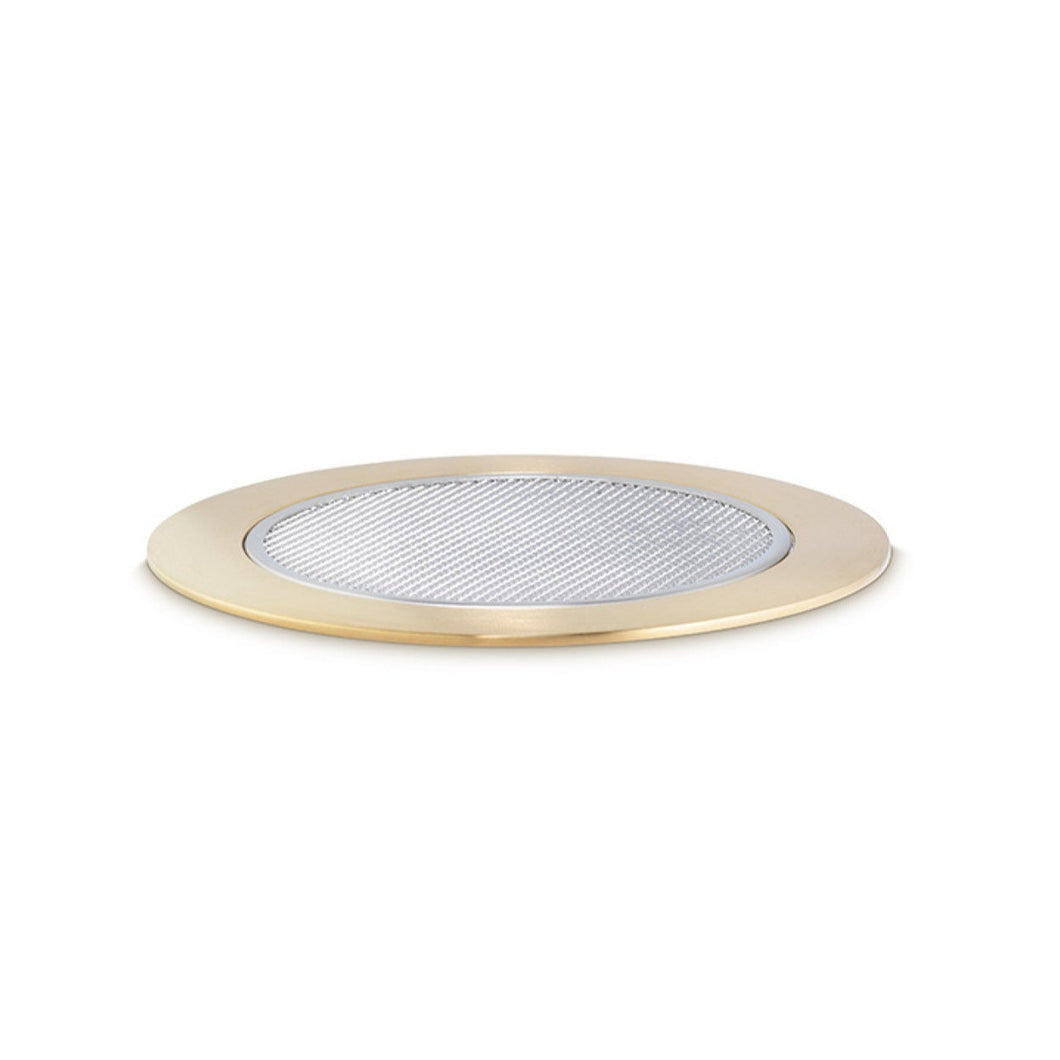 Round metal filter with brass rim on a white background